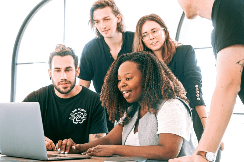 a team discussing on a laptop
