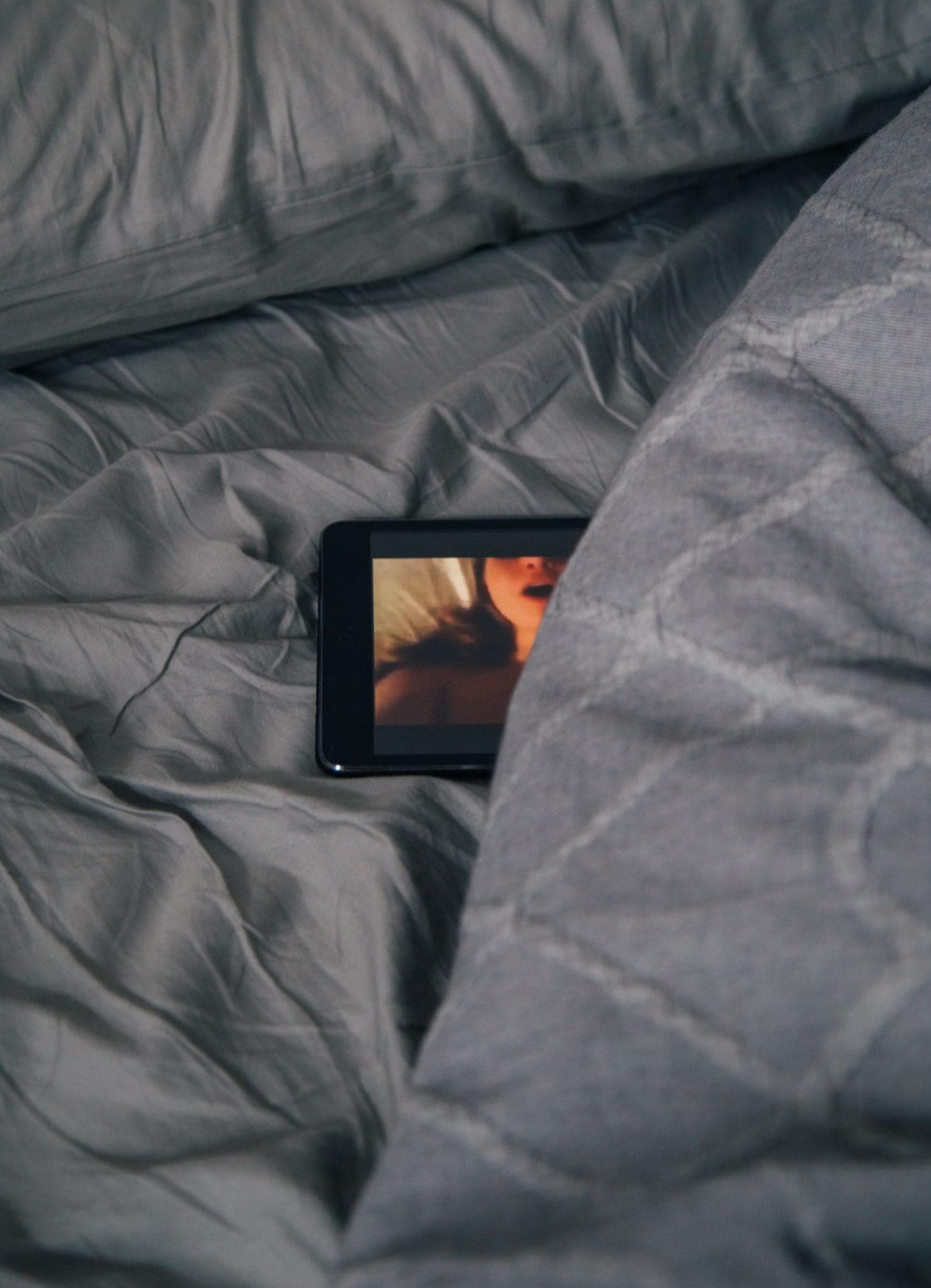 a phone on a blanket